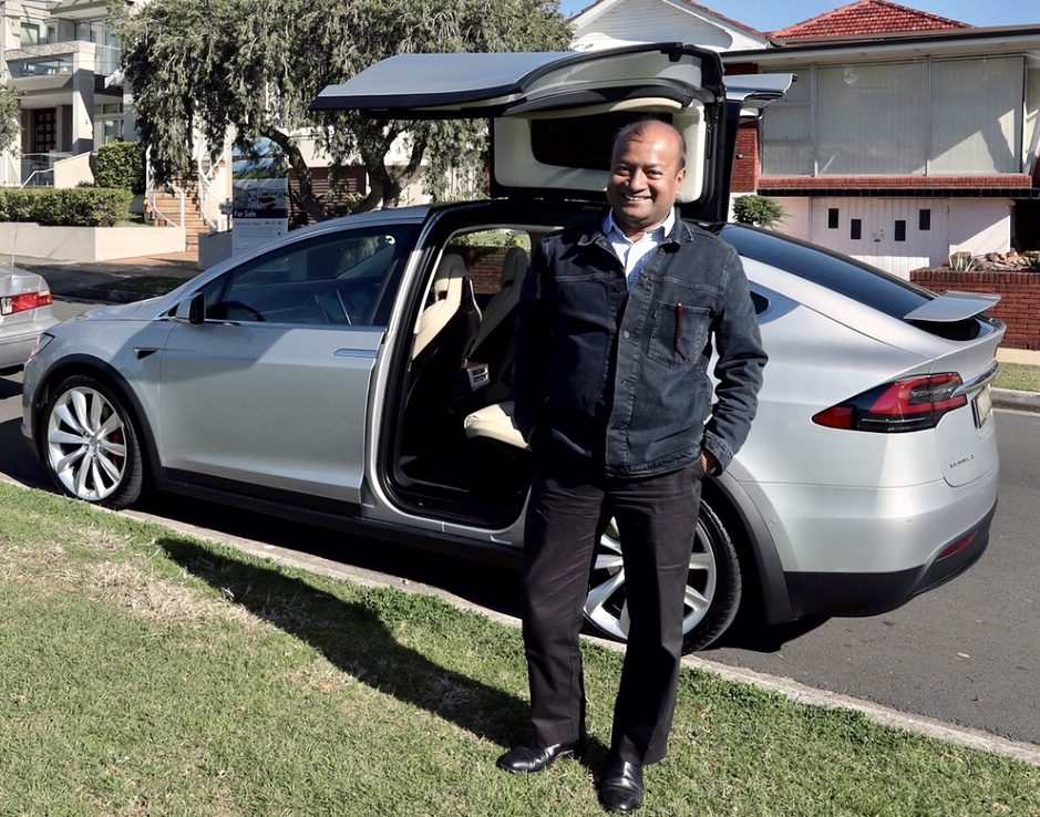 Sohail Hasnie test-driving a Tesla Model X in suburban Australia, 2018